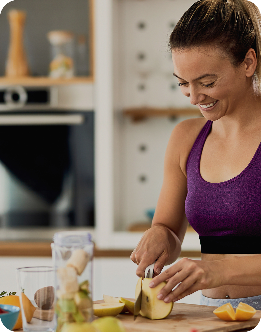 Lady is cutting vegetables in kitchen